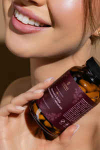 Close-up of woman holding Sanvee women's multivitamin and minerals bottle